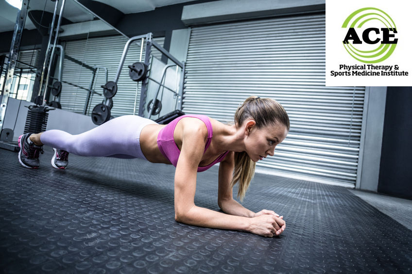 42341351 - side view of a muscular woman on a plank position